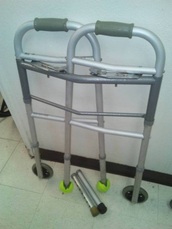 lot 387 image: Aluminum Walker with wheels, and legs.
