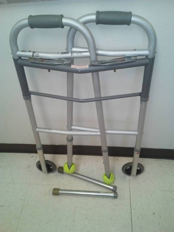 lot 388 image: Aluminum Walker with wheels and legs.