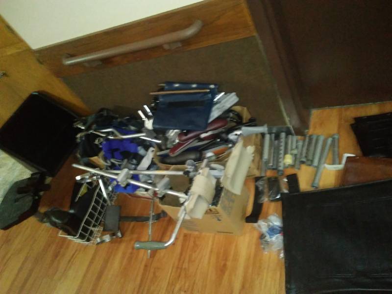 lot 404 image: Miscellaneous orthopedic equipment machine parts wheelchair seats, braces.