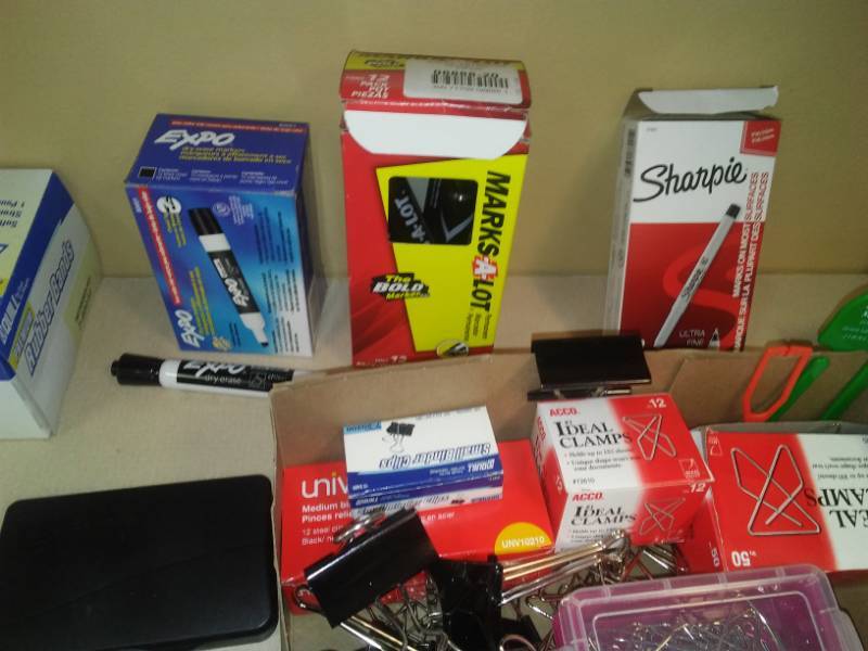 lot 331 image: Miscellaneous office supplies. Three hole punch, markers, labels, pens and more.
