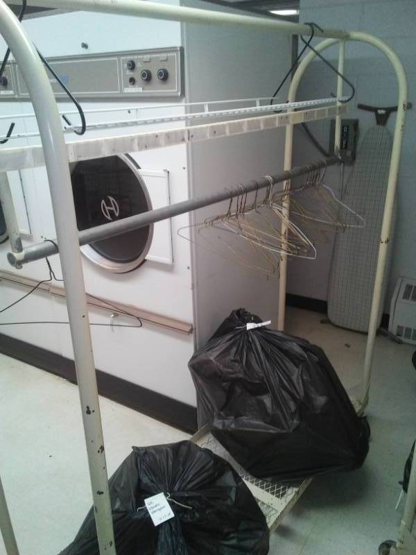 lot 176 image: Commercial Hanging Clothing Racks, on caster wheels,