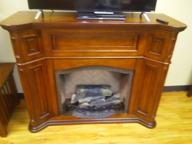 lot 195 image: Electric Fire Place w wood surround. Dimplex with remote. 