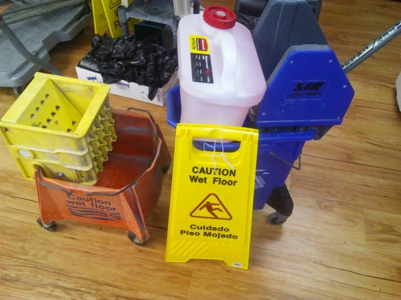 lot 495 image: Two mop bucket, Rubbermaid dispenser and more.