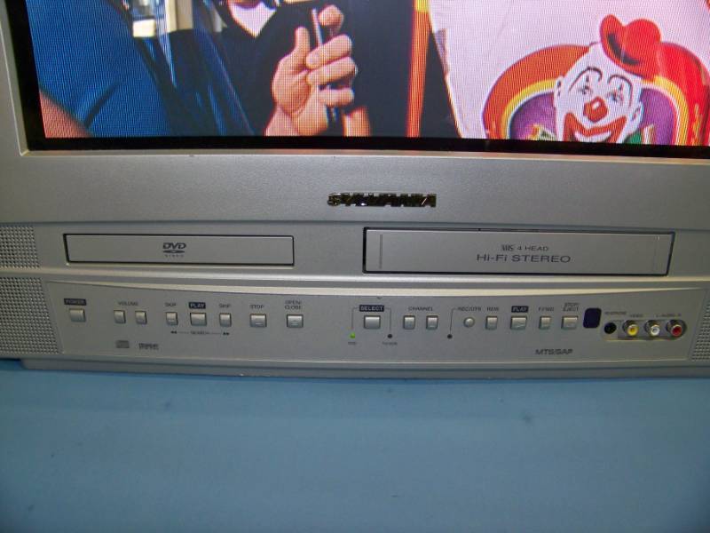 lot 182 image: 20, Sylvania, True Flat CRT Television  TV with Built-In DVD  VCR Combo and Remote Control