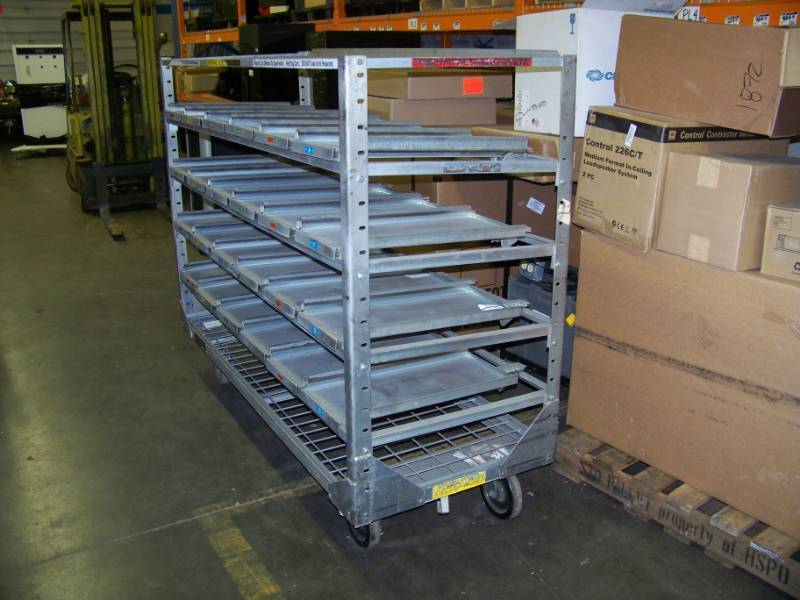 lot 102 image: Large, Metal, Rolling, Heavy-Duty Industrial Warehouse Cart with Pull-Out Shelves and Locking Casters