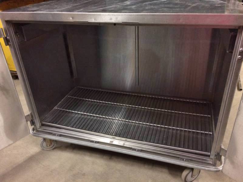 lot 44 image: WOW MSRP $3800 Suburban Heavy-gauge Type 304 Stainless Steel Multi-purpose Mobile 4 Foot Enclosed Case Cart Cabinet With Bumper Guard, Double Door, Locking Wheels, Push Down To Open Knobs & Wire Shelves - Great For Restaurants & More