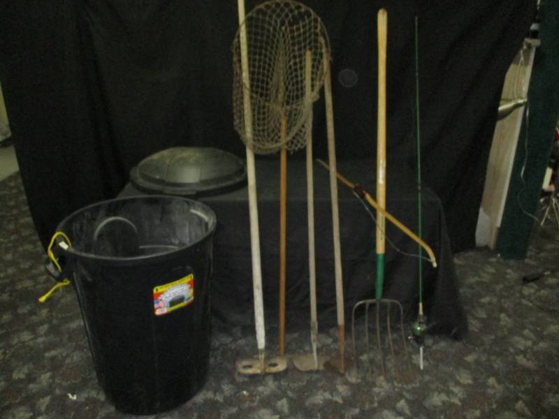 lot 16 image: Garbage can, for, antique fishing net, kids recurve bow has good string, 3 hoes and pitch fork