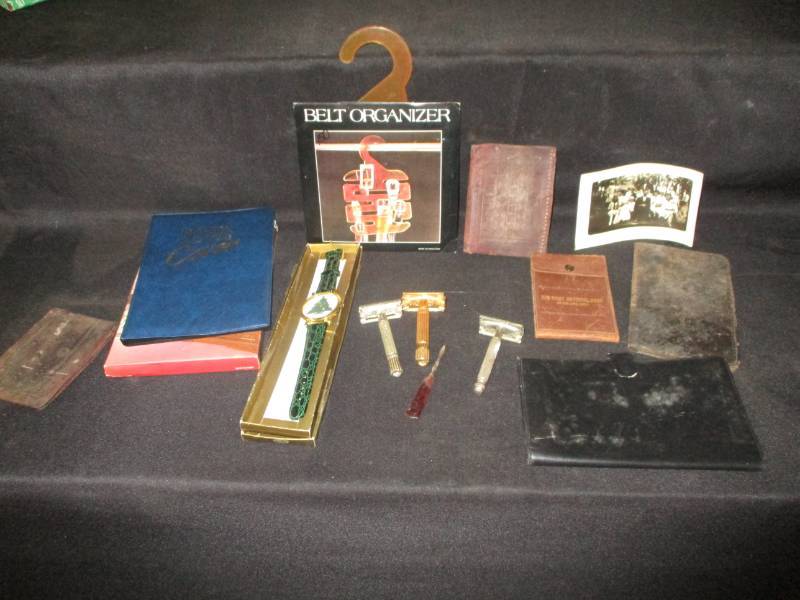 lot 60 image: First National Banknote holder, old razors, black and white picture, belt organizer and tv guide cover plus old leather wallet and more