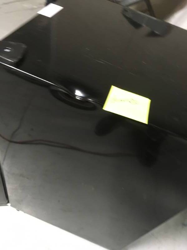 Magic Chef  4.4 cu. ft. Mini Refrigerator in Black  not used whit dents on the side