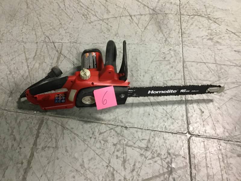 lot 6 image: Homelite 16 in. 12 Amp Electric Chainsaw USED in good condition