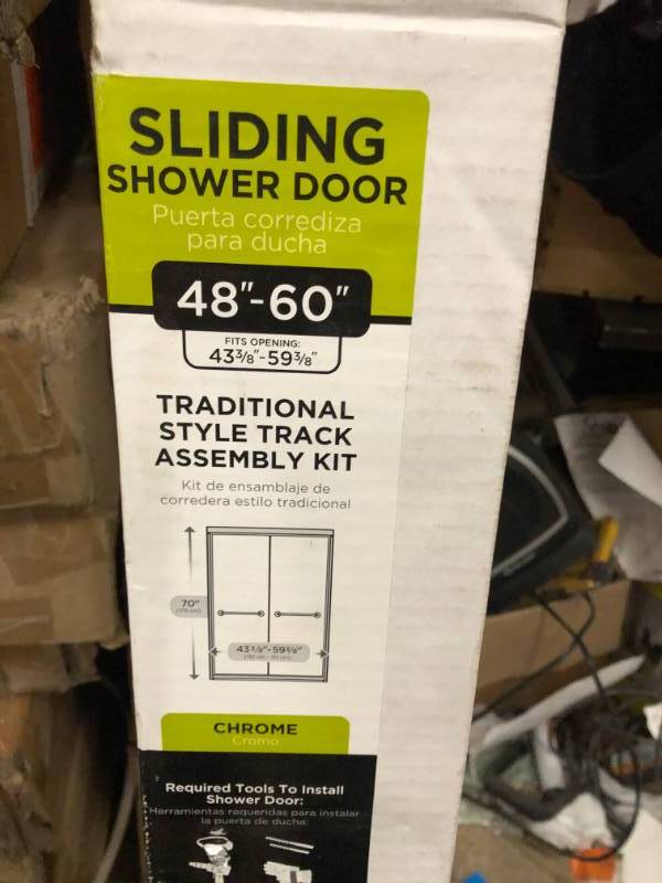 lot 91 image: Delta 48 in. to 60 in. Sliding Shower Door Track Assembly Kit in Chrome open box in like new condition