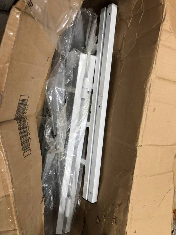 lot 97 image: Segal  21 in., White Painted Carbon Steel, Hinged 4-Bar Window Grill  NOT USED