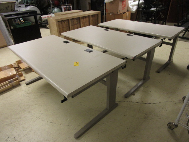 lot 511 image: 3 ADJUSTABLE WORKSTATION TABLES