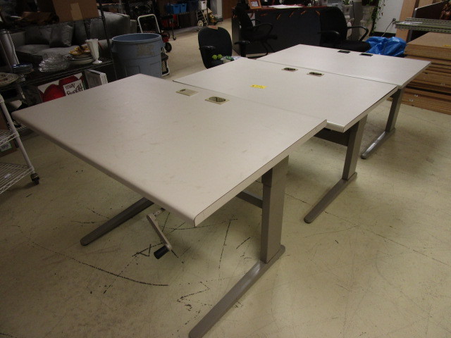 lot 512 image: 3 ADJUSTABLE WORKSTATION TABLES