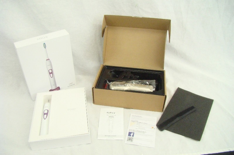 lot 9 image: New in Box Electric Toothbrush and Hair Clippers