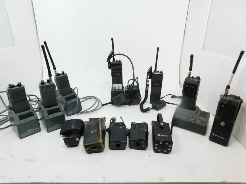 lot 60 image: Seven Portable Two-Way Radios & Five Battery Chargers & Five Radio Holders For On Your Belt