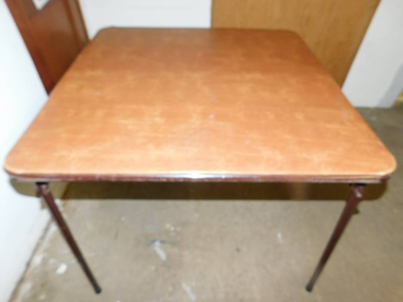 lot 76 image: Square Rust Colored With Brown Fold Up Legs Card Table