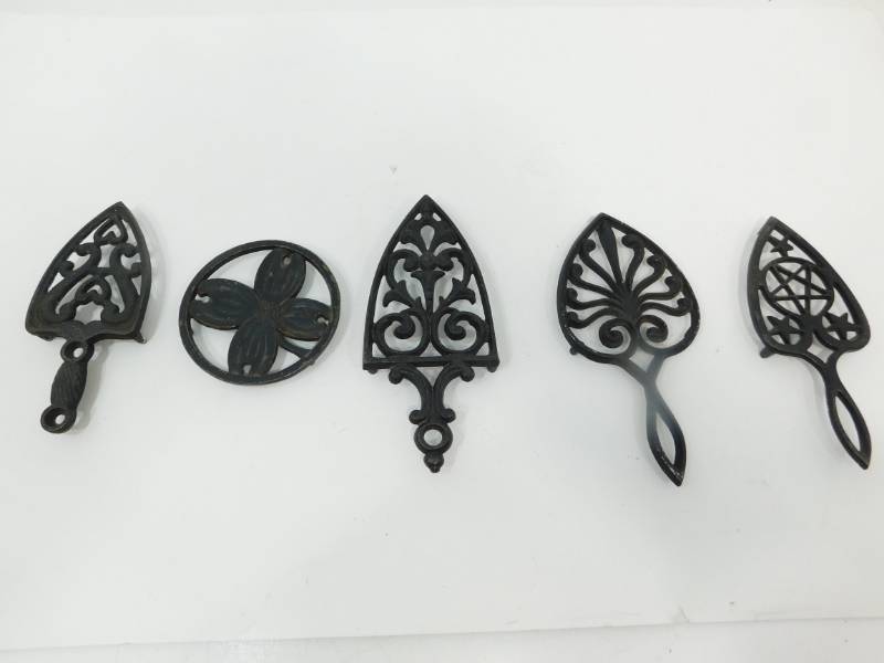 lot 85 image: Five Decorative Cast Iron Trivets