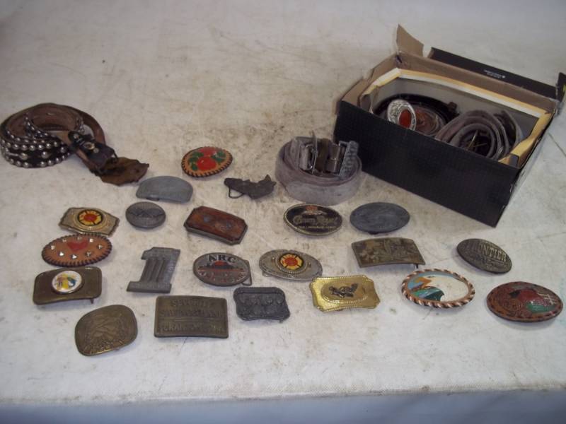lot 102 image: Belt buckles and belts