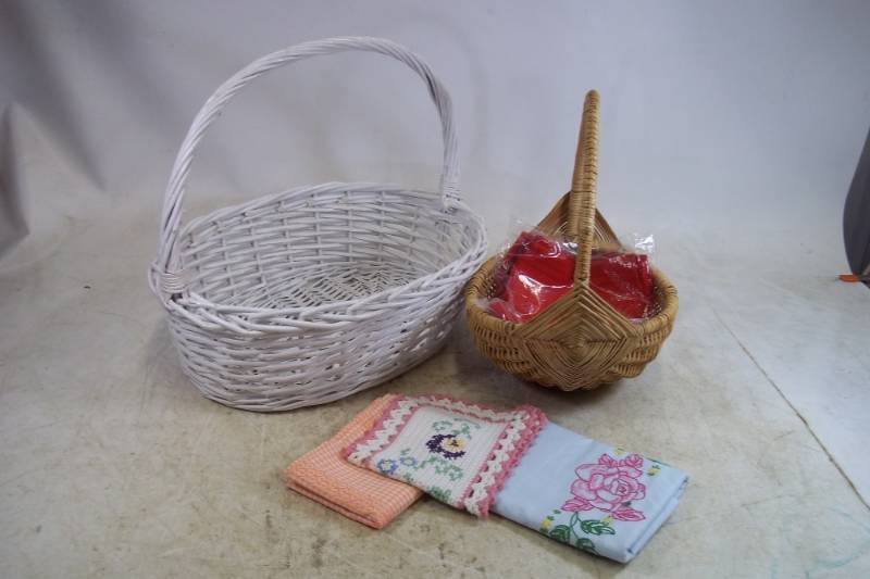 lot 155 image: X Large Wicker Baskets, Embroidered Pillow Cases, Linens