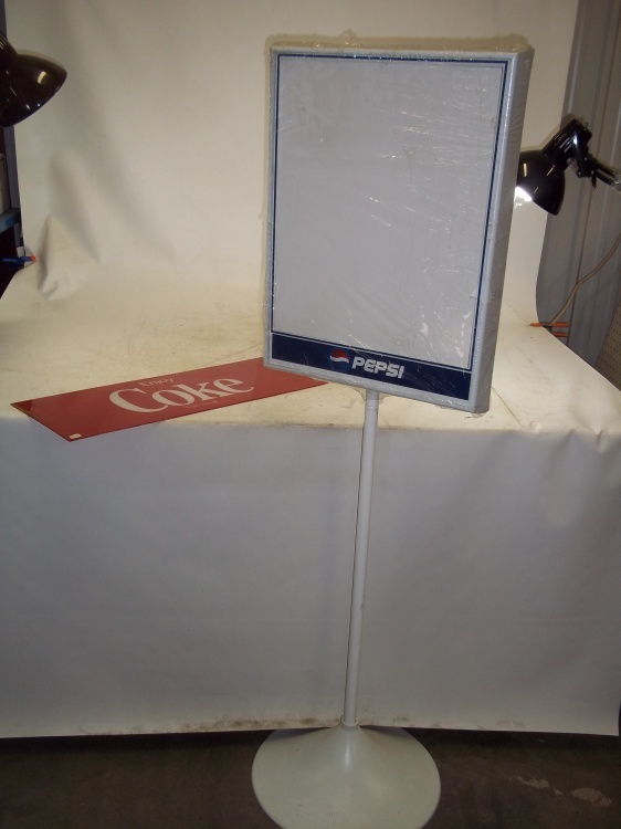 lot 72 image: Pepsi Dry Eraser Display Stand never used, and Plexi Coke Sign