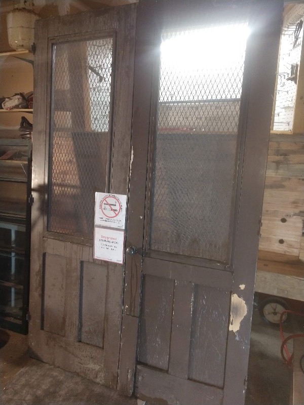 lot 29 image: Vintage Industrial Brown Wood Double Door w Metal Wire Fencing and Screen