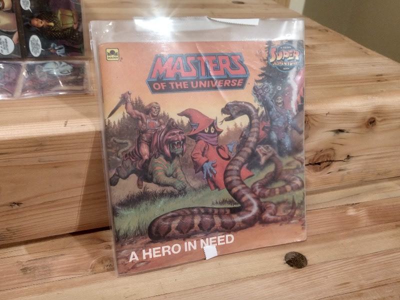 lot 69 image: A Hero in Need (Masters of the Universe) Book and Comic Images SHI Cards