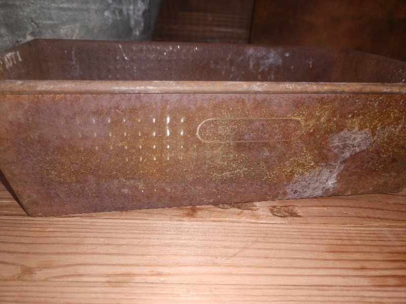lot 141 image: Vintage Galvanized Watering Can, Vintage EKCO No. 7 Bread Pan, and Leather Upholstered Board