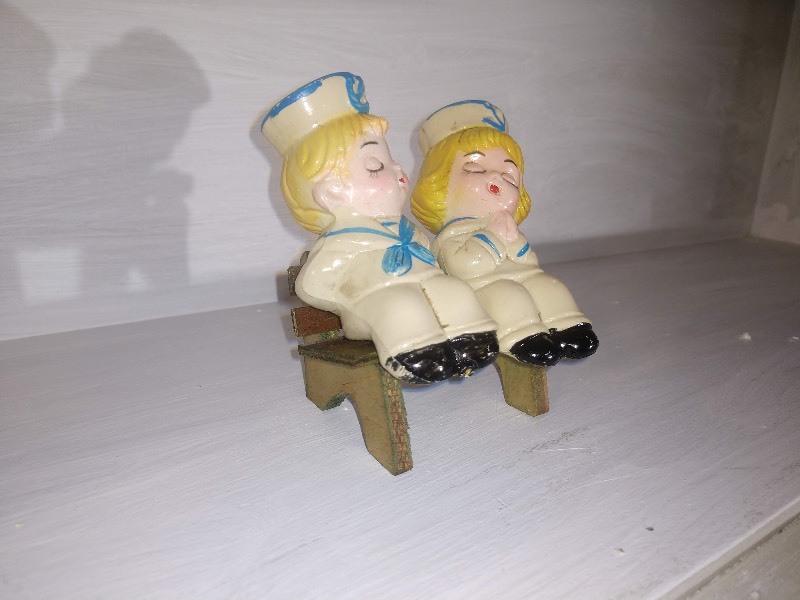 lot 173 image: Vintage Kissing Sailor Boy and Girl on a Bench Plastic Salt and Pepper Shakers (1960s)
