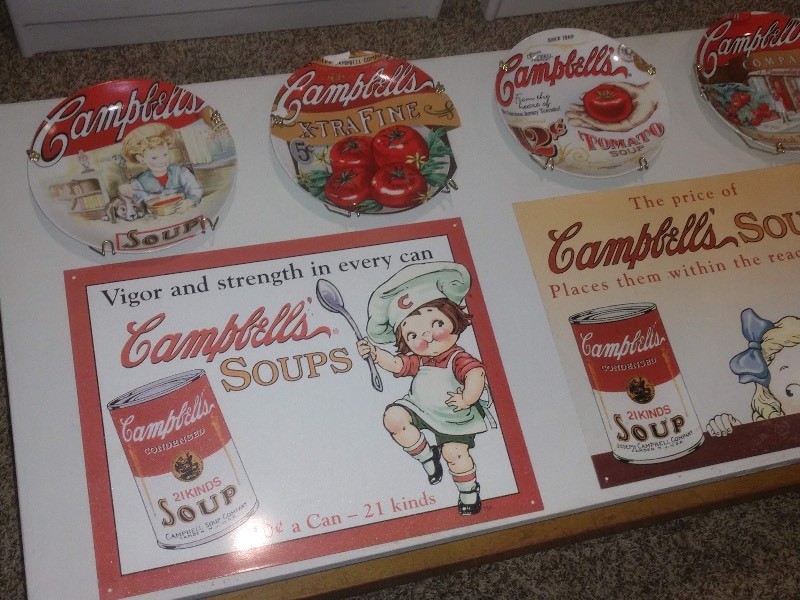 lot 174 image: Four Campbells Plates and Two Campbells Tin Signs