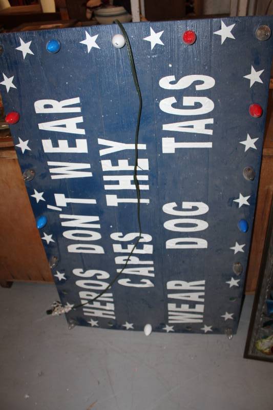lot 26 image: Heros Dont Wear Capes They Wear Dog Tags Wall Art