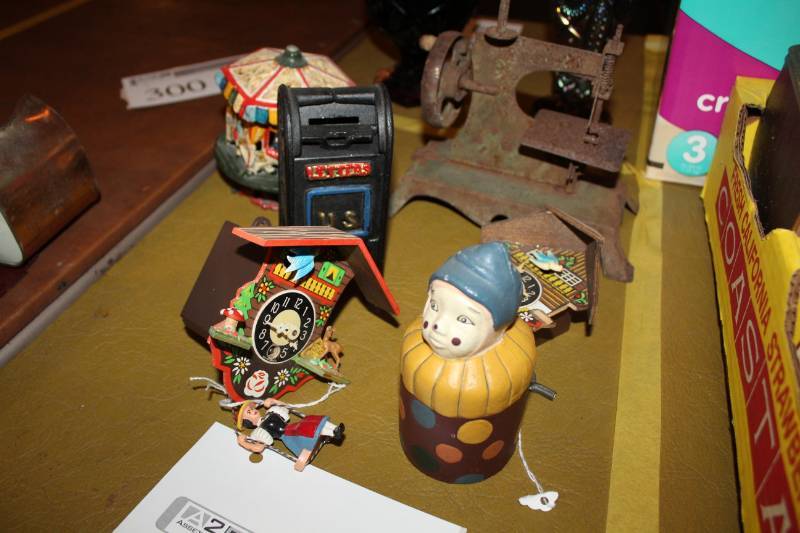 lot 301 image: Vintage Clocks, Piggy Banks, Sewing Machine