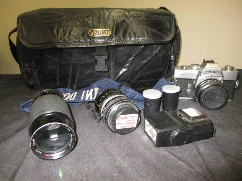 lot 15 image: Minolta Camera 2 extra lenses, flash and extras