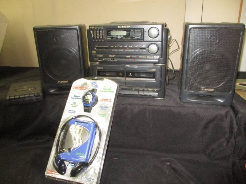 lot 41 image: Sony Sharp radio , walkman still in plastic and casseete recorder player seems to work