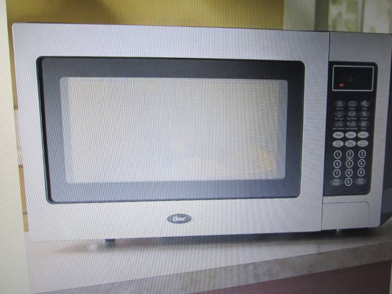 lot 66 image: Stainless Steel 1.1 Cu. Ft. Microwa...
