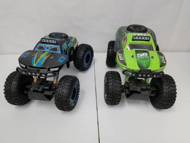 lot 18 image: 2 Remote Control Monster Trucks by Maisto