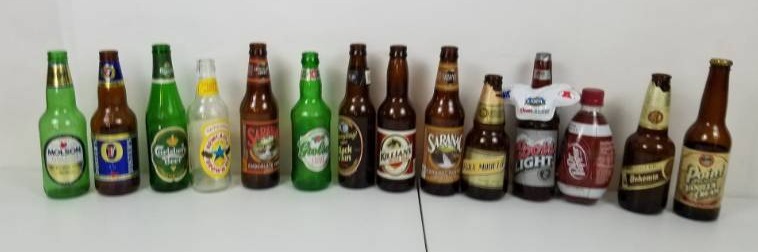 lot 48 image: Lot of 12 Collectible Imported & American empty beer bottles