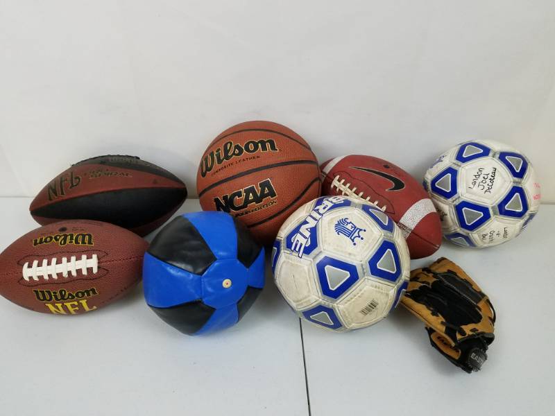 lot 88 image: Tote of sporting goods Football Soccer Ball Punching ball
