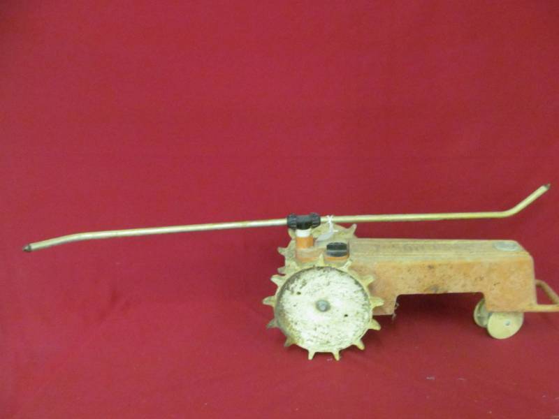 lot 99 image: Melnor tractor sprinkler