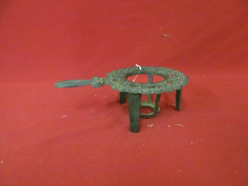 lot 104 image: cast-iron warmer trivet