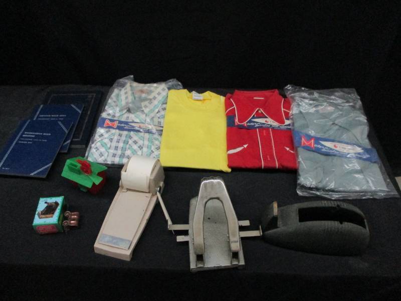 lot 102 image: Shirts, coin holders, bank ans sharpeners