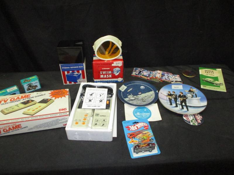 lot 167 image: Beatles collector plate, Neil Armstrong collector plate, hotwheels, baseball cards, Twins buttons, TV electronic game, and pencil sharpeners