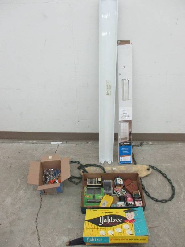lot 26 image: Light Balaster, White Window Blind, Old Swing Seat, Door Handles, old light bulbs, house numbers, tire plug kit, Umbrella, Game