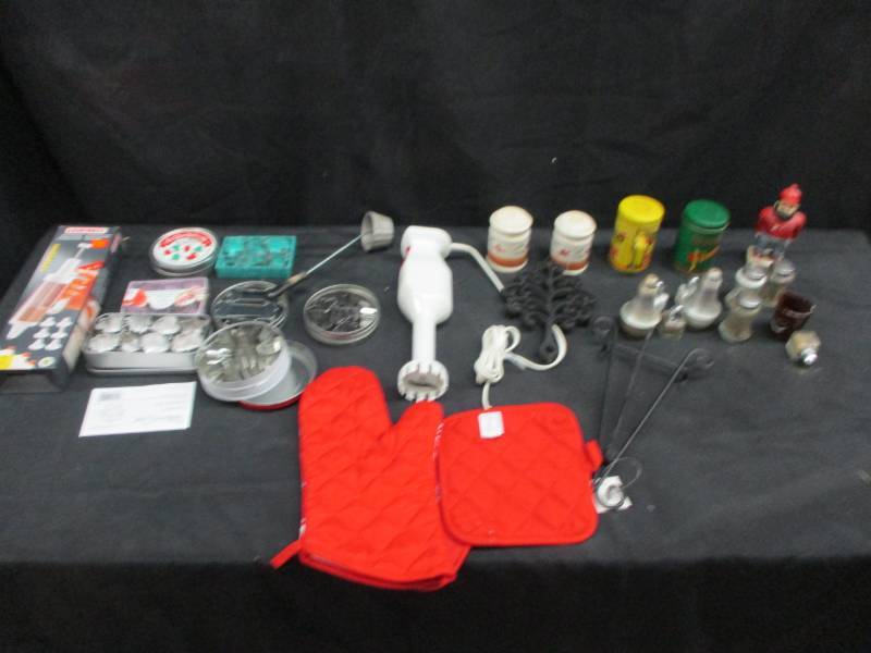 lot 56 image: Cake decorating kit, cookie cutters, pot holders, shake beater, salt and pepper shakers