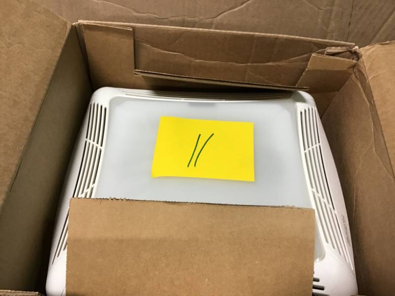 lot 11 image: NuTone 50 CFM Ceiling Bathroom Exhaust Fan with Light open box in like new condition