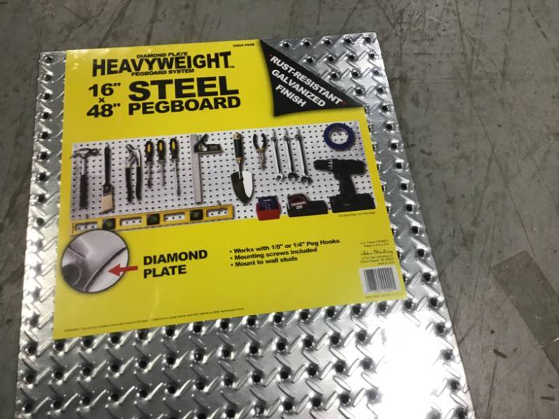 lot 49 image: Knape & Vogt 16 in. x 48 in. Diamond Plate Galvanized Steel Pegboard not used