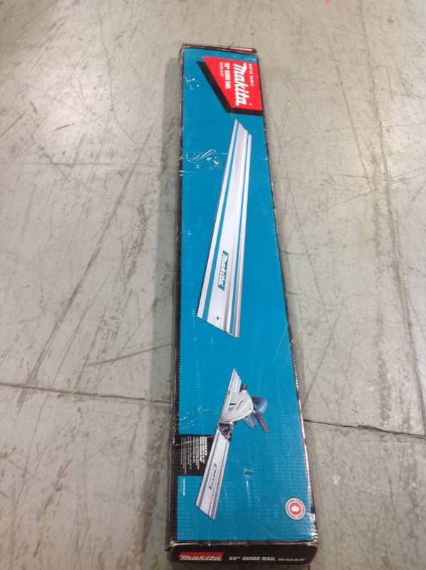 lot 104 image: Makita  55 in. Plunge Saw Guide Rail NOT USED