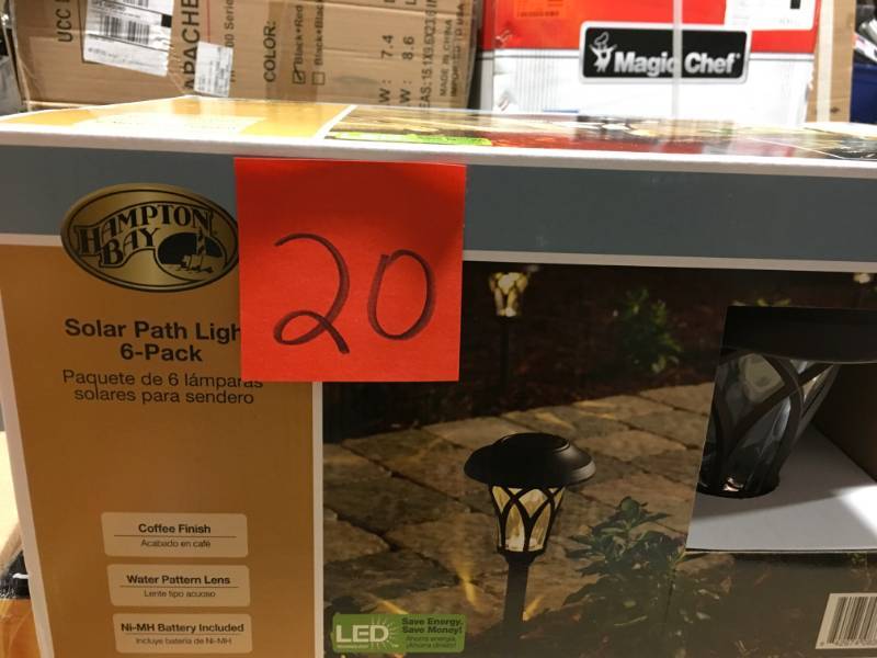 lot 20 image: Hampton Bay Solar Bronze Outdoor Integrated LED Landscape Fan Cage Path Light with Water Glass Lens (6-Pack) not used