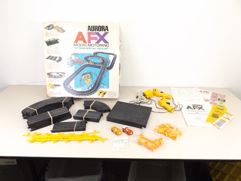 lot 39 image: Vintage Aurora AFX Slot Cars and Track in Original Box