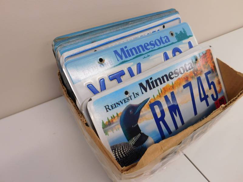 lot 57 image: Box of Old License Plates